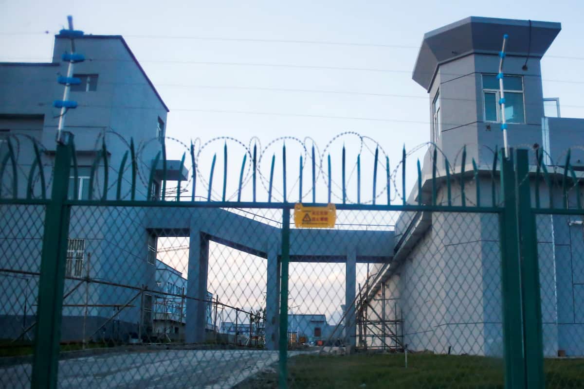 A perimeter fence around a "vocational skills education center" in Xinjiang in 2018. Police detained two Reuters journalists for more than four hours after the photo was taken.