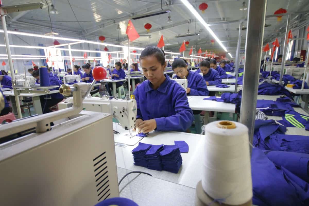 Uigur women work in a cloth factory in Hotan county, Xinjiang province, China.