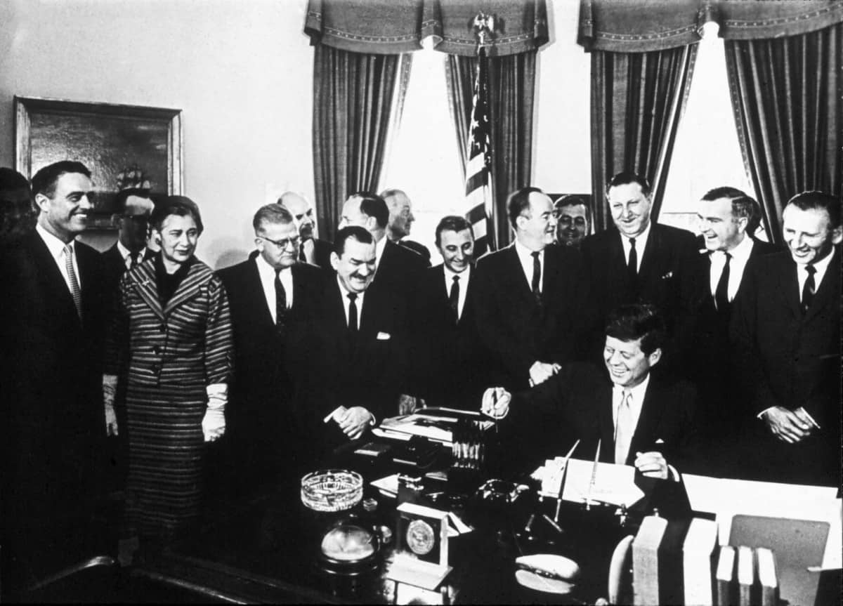President John F. Kennedy signing the Peace Corps Act legislation at the White House on September 22, 1961.