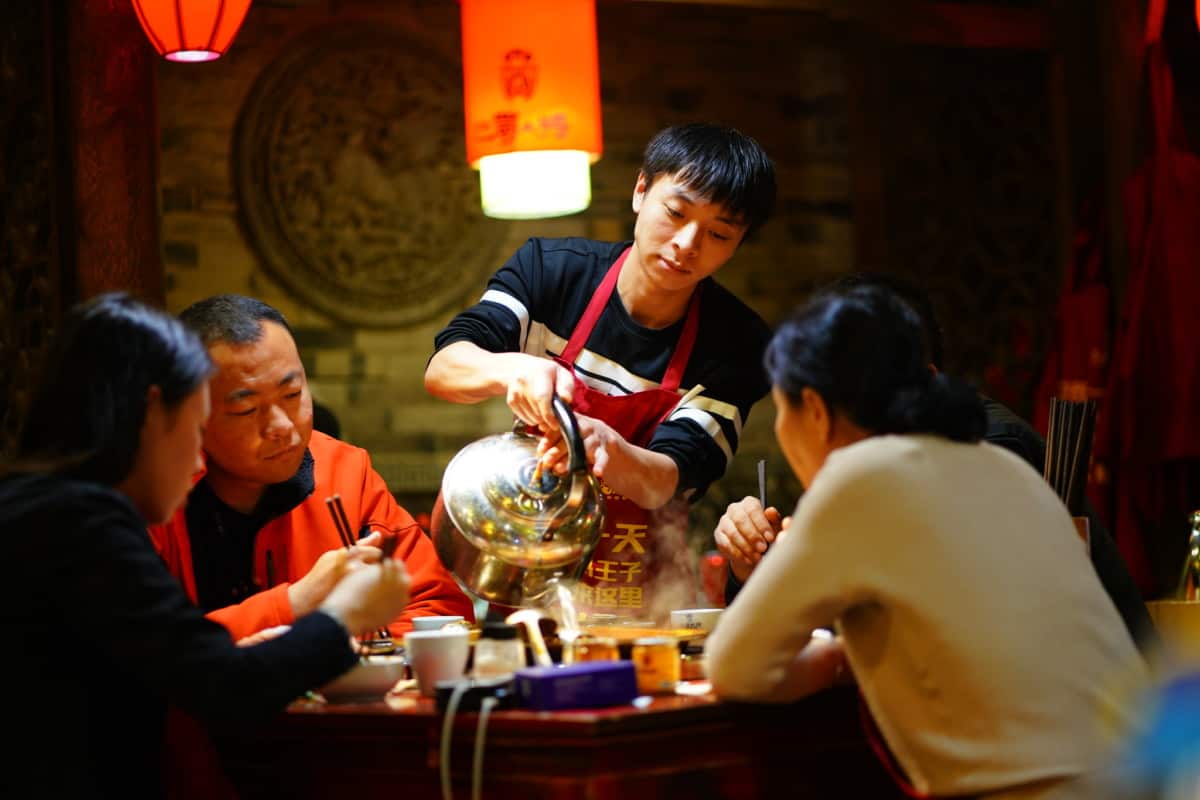 People in a hot pot restaurant in Chengdu