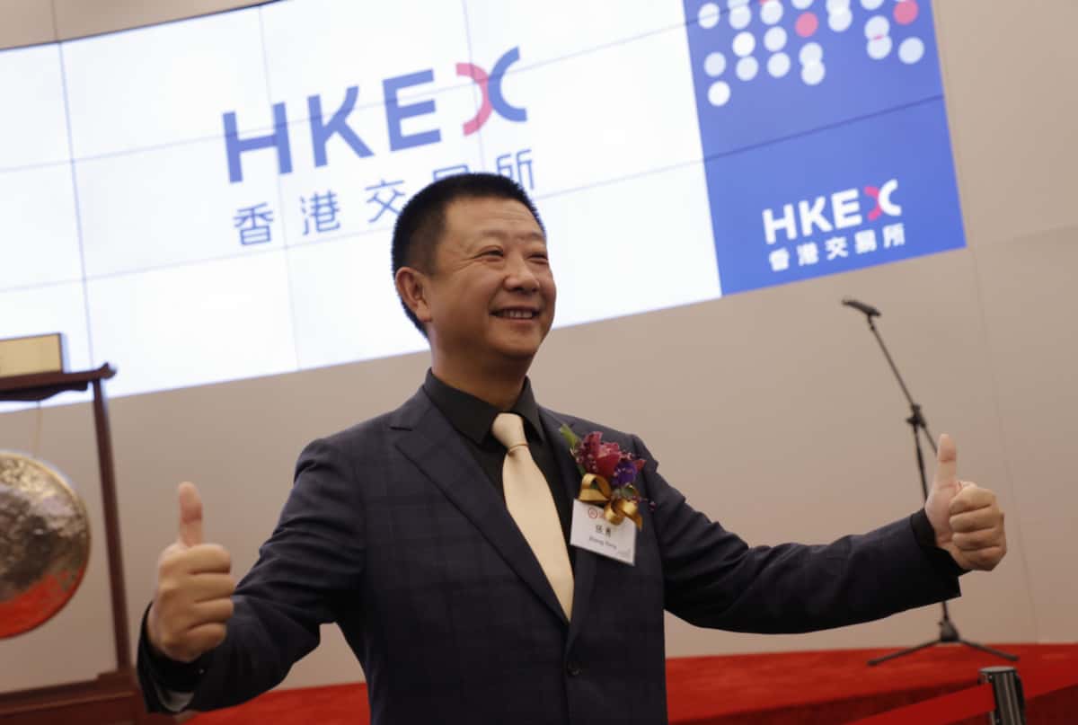 Zhang Yong, founder of Chinese hotpot chain Haidilao, poses during the company's listing ceremony at the Hong Kong Stock Exchange, Sept. 26, 2018.