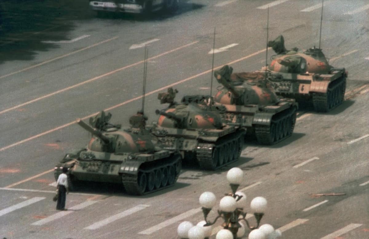 A Chinese man stands alone to block a line of tanks heading east on Beijing's Changan Boulevard in Tiananmen Square on June 5, 1989.