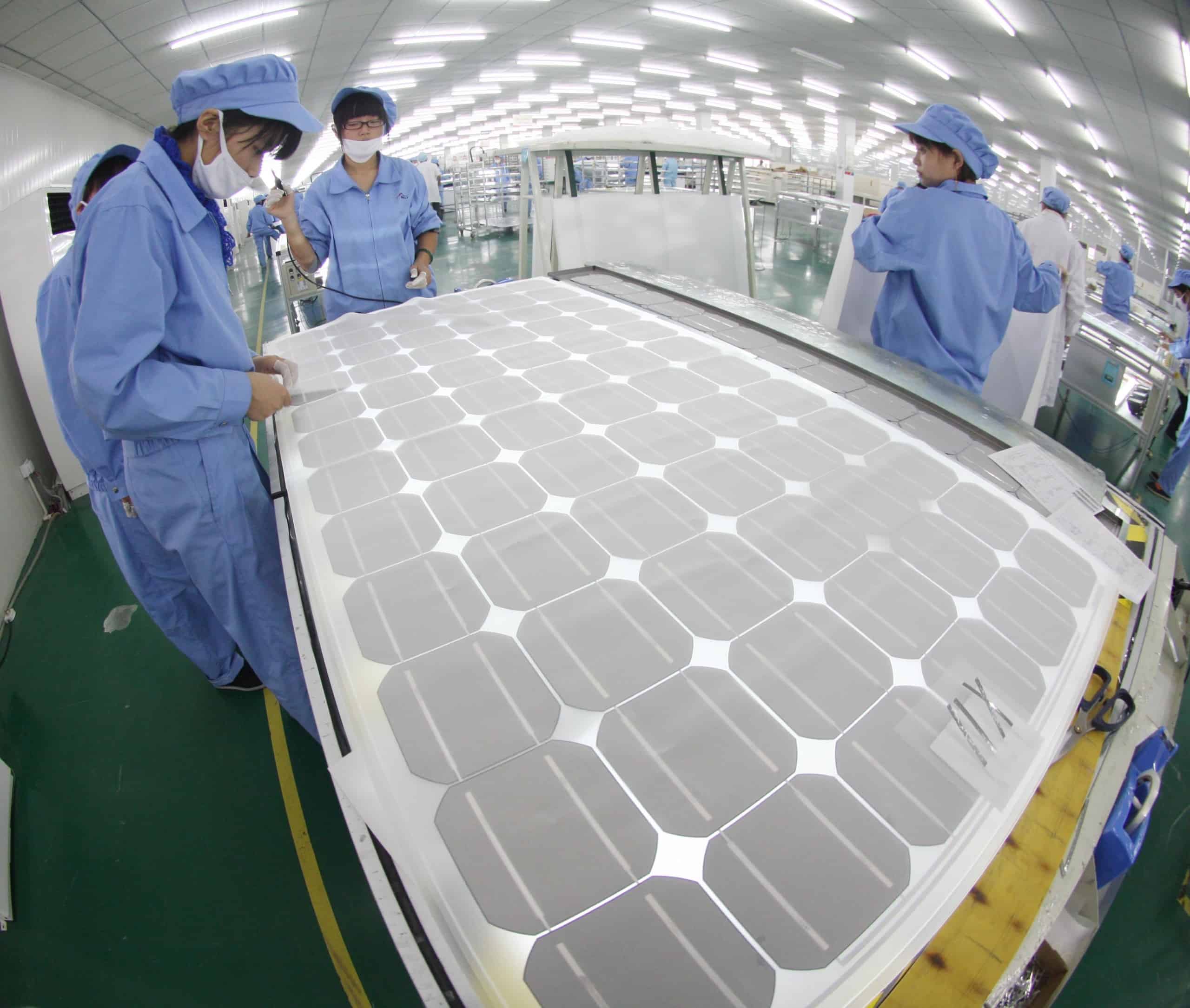Solar cell modules being produced in a factory in Jiangsu province, China.