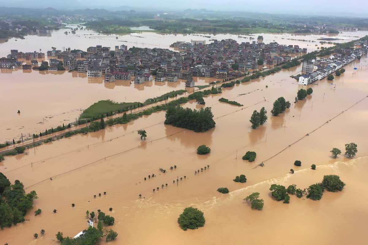 Floodwaters flow around a town in Shangrao in central China's Jiangxi province